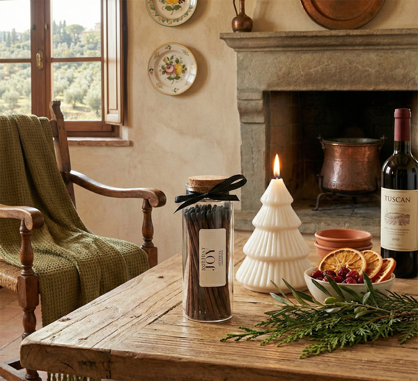 Cozy living room with a wooden table, chair, and decorative items including a bottle of Tuscan wine.